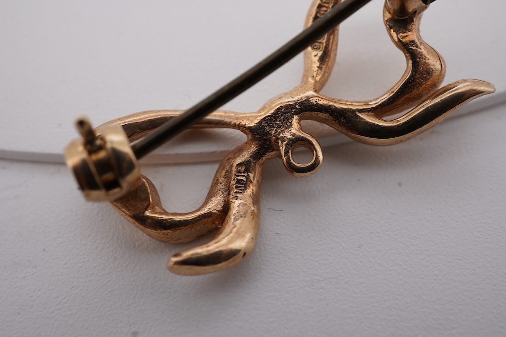Five assorted items of jewellery including an early 20th century yellow metal and seed pearl set acorn bar brooch, 31mm, a similar yellow metal and split pearl ring ring (one missing), with diamond chip spacers, a modern